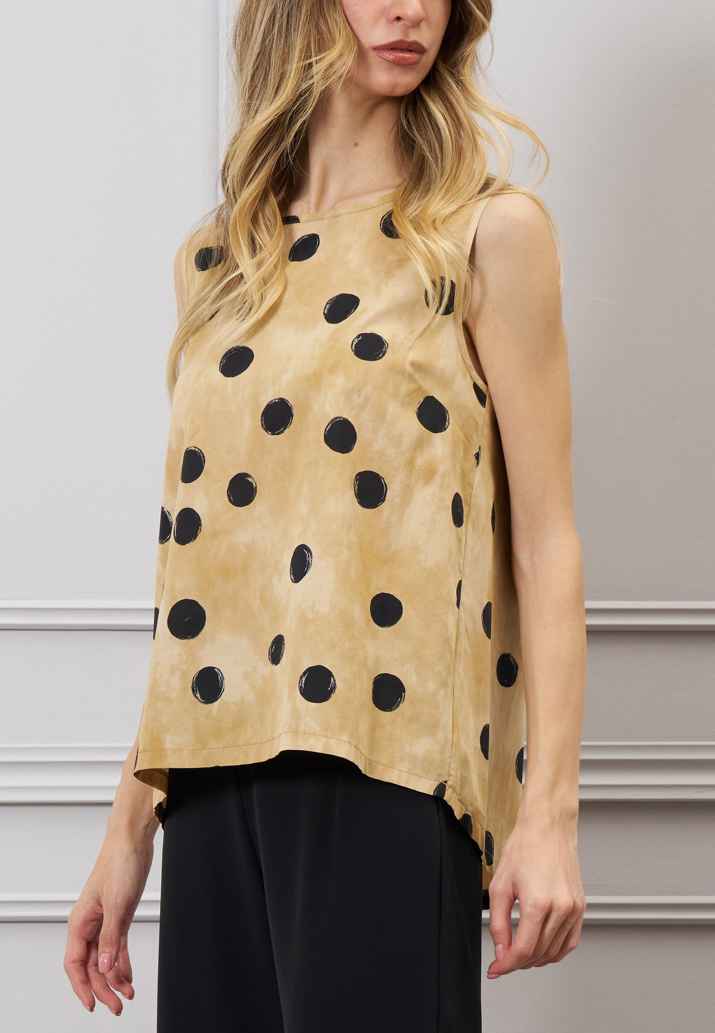 Blusa over a pois con fiocco
