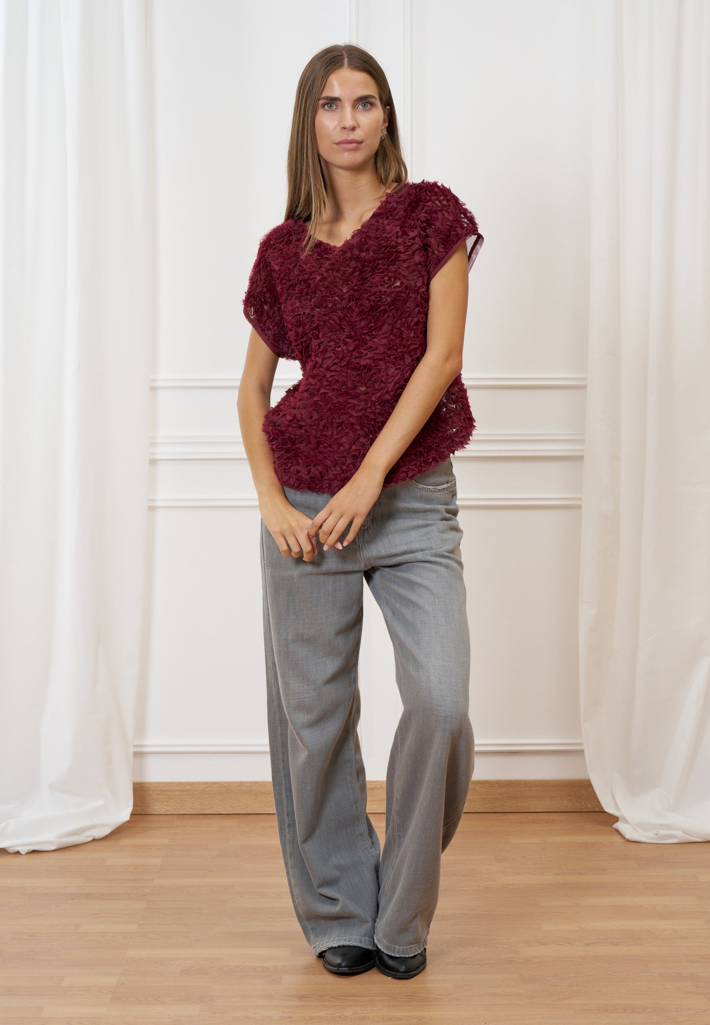 Blusa trasparente con frange