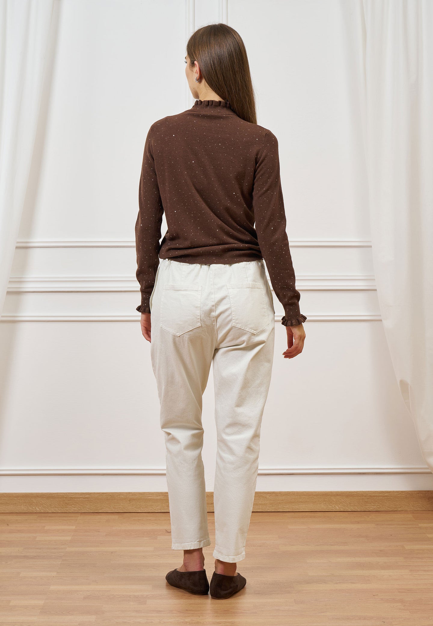 Maglia con rouches e paillettes