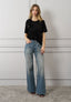 T-shirt con rouches e fiori