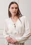 Blusa arricciata in vita