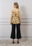 Blusa over a pois con fiocco