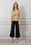 Blusa over a pois con fiocco