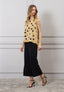 Blusa over a pois con fiocco