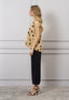 Blusa over a pois con fiocco