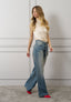 Blusa raso smanicata collo alto