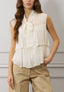 Blusa smanicata con volant