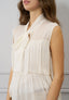 Blusa smanicata con volant