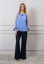 Blusa spalle scoperte con fiore