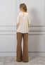 Blusa spalle scoperte con fiore
