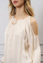 Blusa spalle scoperte con fiore