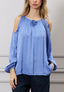 Blusa spalle scoperte con fiore
