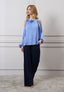 Blusa spalle scoperte con fiore