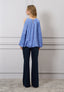 Blusa spalle scoperte con fiore