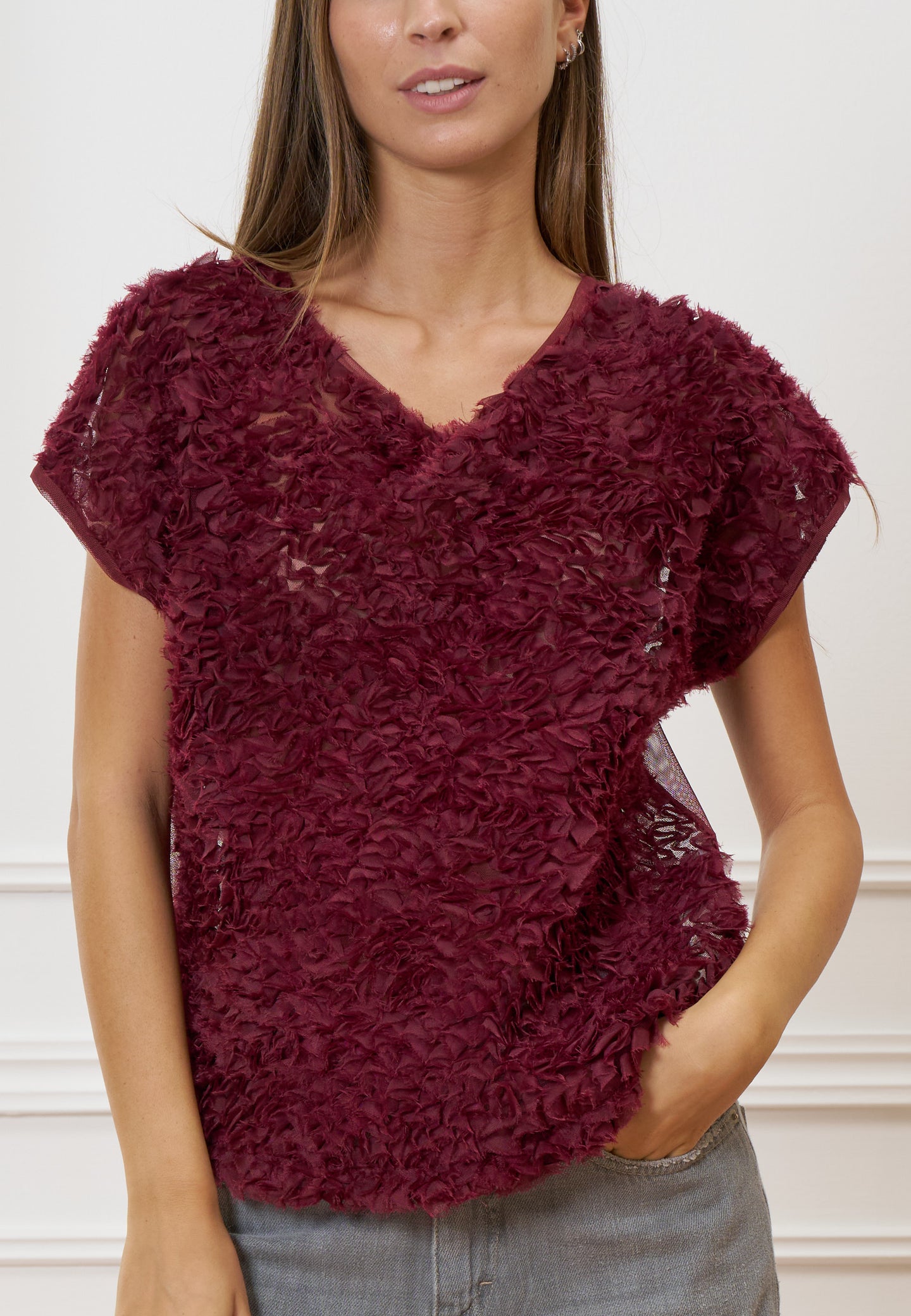 Blusa trasparente con frange