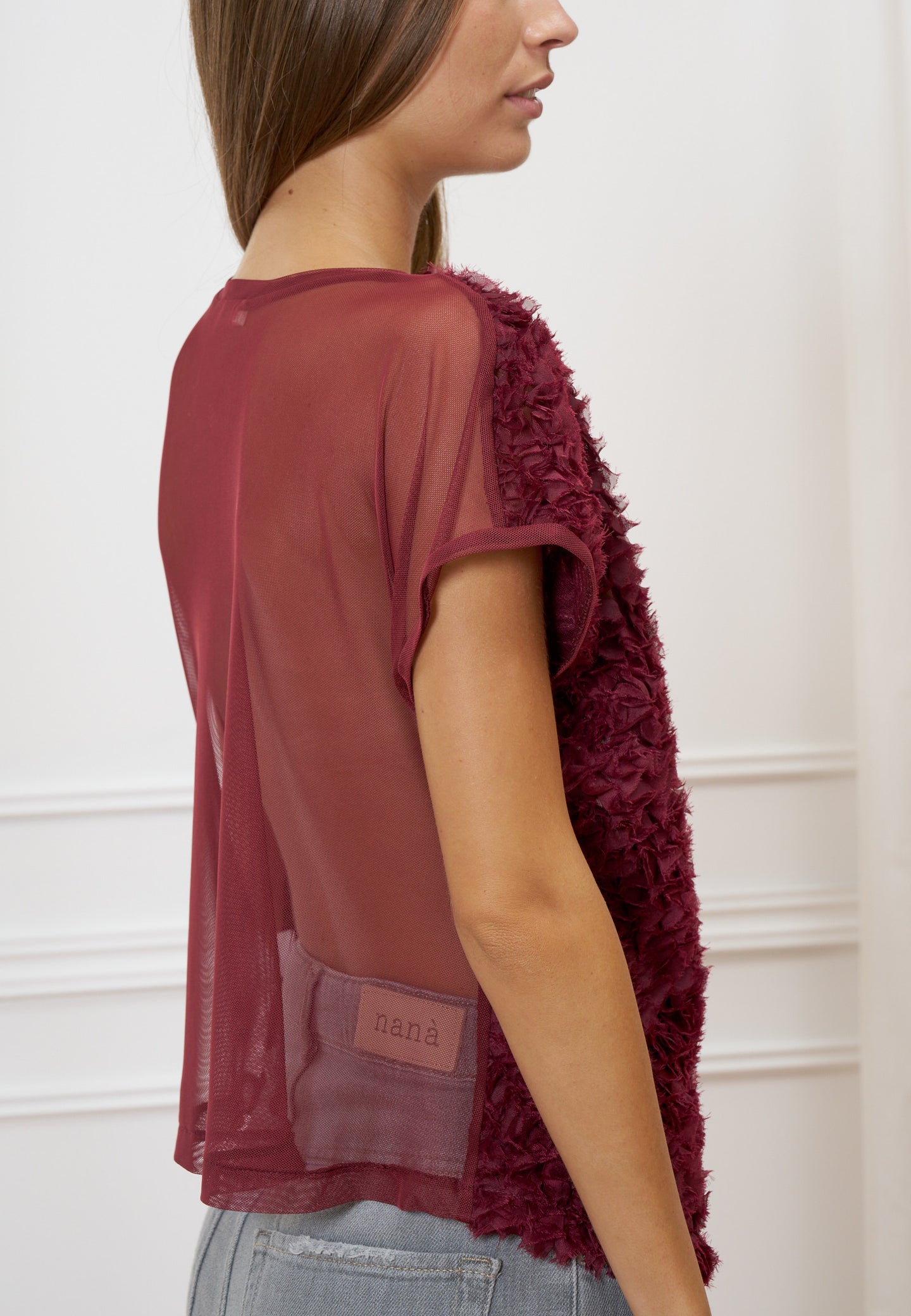 Blusa trasparente con frange