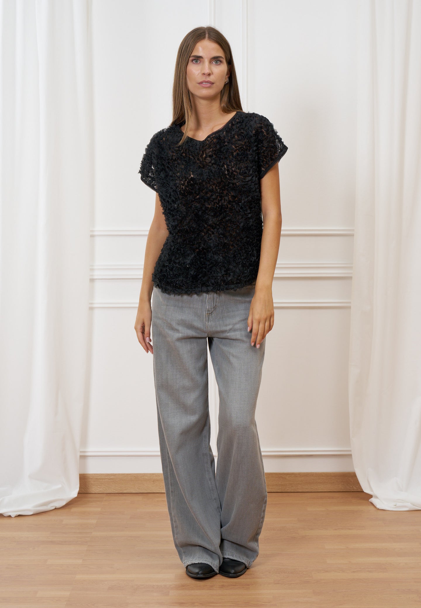 Blusa trasparente con frange