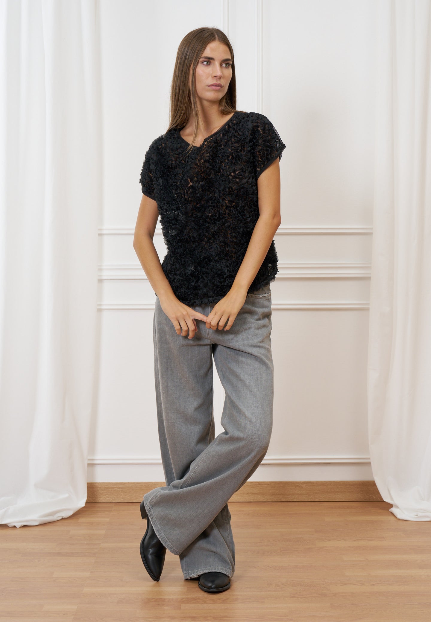 Blusa trasparente con frange