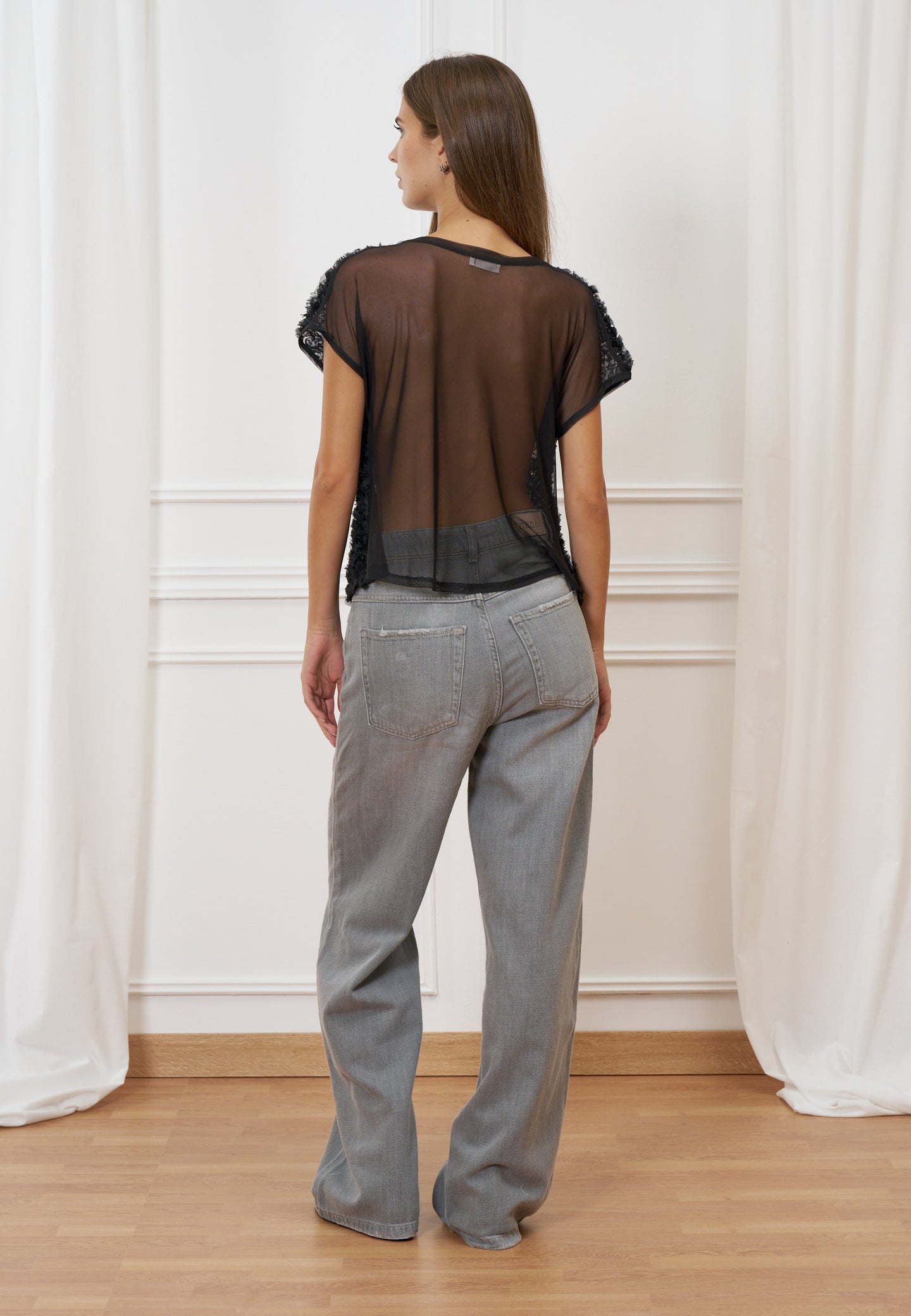 Blusa trasparente con frange