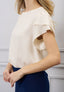 Blusa lurex maniche petalo