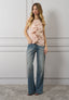 Camicia smanicata con volant
