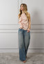 Camicia smanicata con volant
