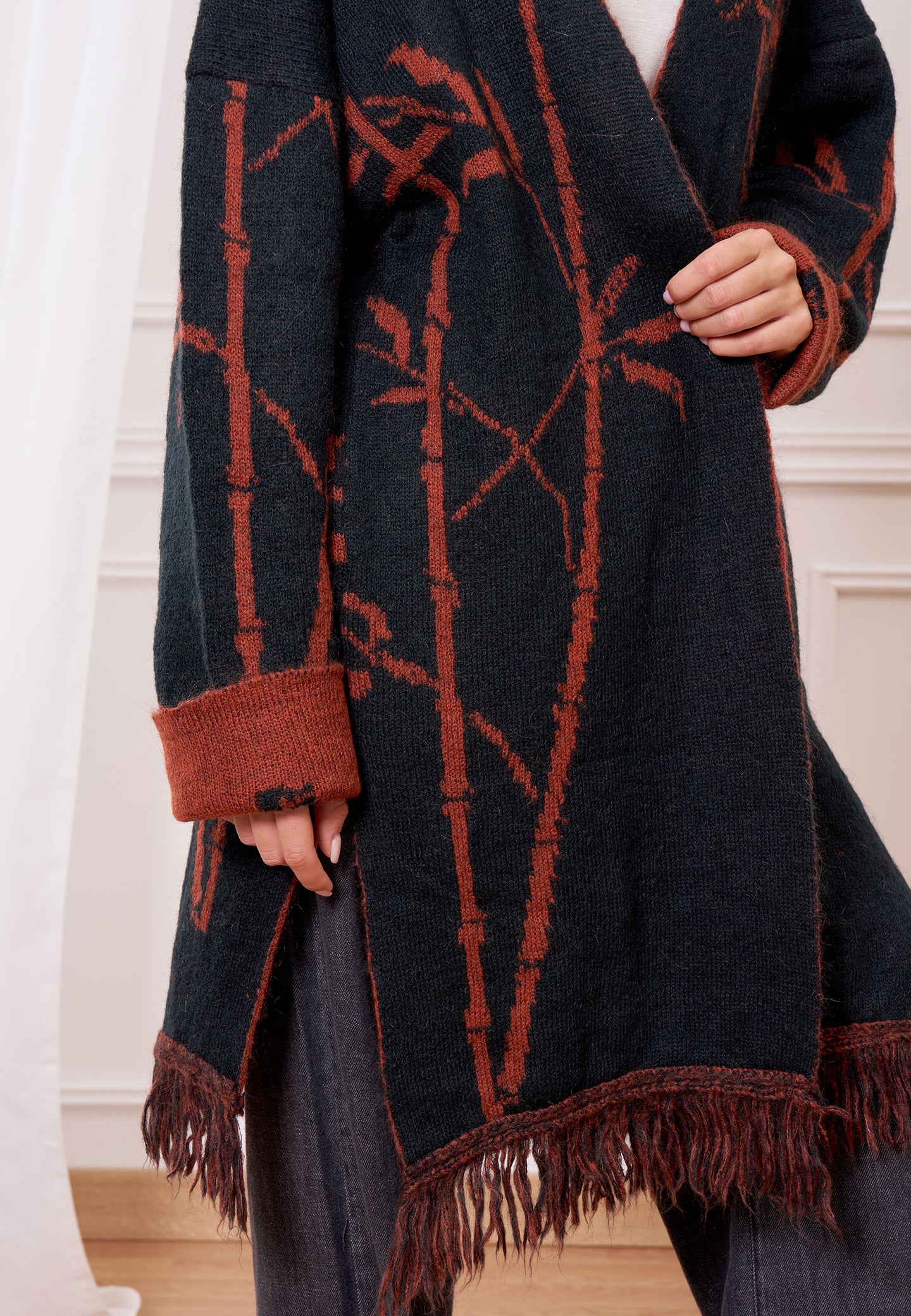 Cappotto maglia jacquard con frange