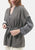 Cardigan smanicato bouclè con pailettes