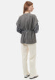 Cardigan smanicato bouclè con pailettes