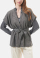 Cardigan smanicato bouclè con pailettes