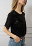 T-shirt con rouches e fiori