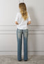 T-shirt con rouches e fiori
