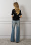 T-shirt con rouches e fiori